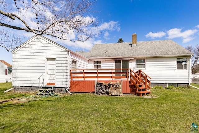 2611 Chambersburg Ave, Duluth, MN 55811 - back of property featuring a chimney, a deck, and a lawn
