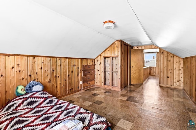 2611 Chambersburg Ave, Duluth, MN 55811 - bedroom with wooden walls, lofted ceiling, and baseboards
