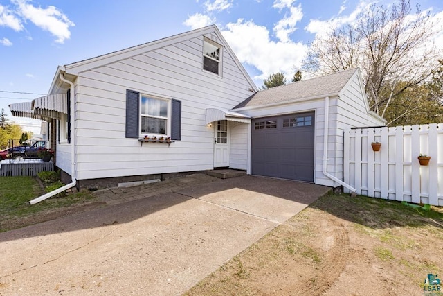 2611 Chambersburg Ave, Duluth, MN 55811 - view of front of property featuring an attached garage and driveway