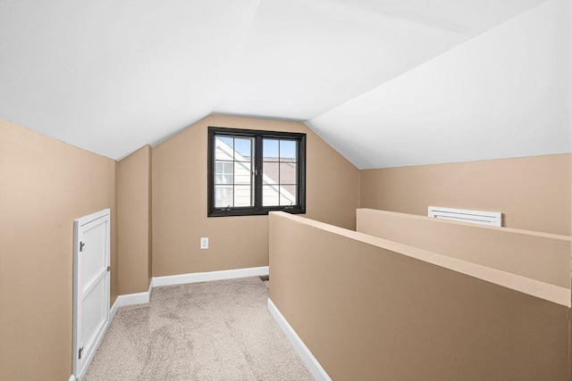4124 Gilliat St, Duluth, MN 55804 - additional living space featuring vaulted ceiling, light colored carpet, and baseboards