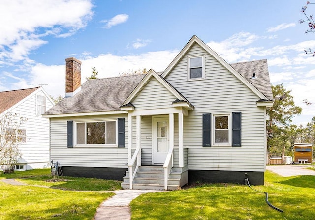 4124 Gilliat St, Duluth, MN 55804 - bungalow-style home featuring a front lawn, roof with shingles, and a chimney