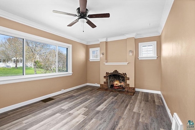 4124 Gilliat St, Duluth, MN 55804 - unfurnished living room with plenty of natural light, baseboards, wood finished floors, a fireplace, and crown molding
