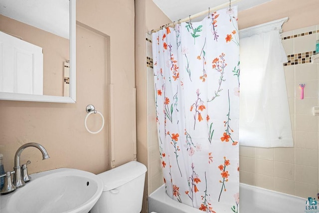2718 W 3rd St, Duluth, MN 55806 - bathroom featuring a sink, shower / bath combination with curtain, and toilet