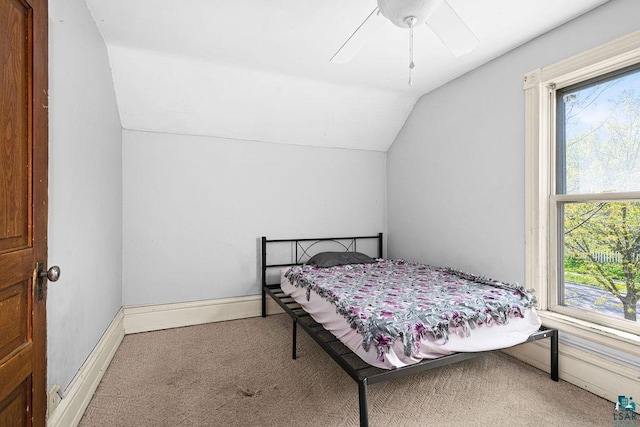 2718 W 3rd St, Duluth, MN 55806 - bedroom featuring lofted ceiling, multiple windows, carpet flooring, ceiling fan, and baseboards