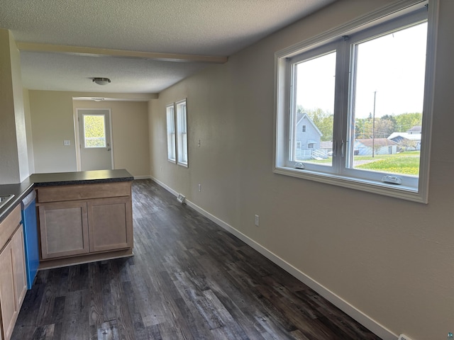 408 Midway Ave, Proctor, MN 55810 - kitchen with a textured ceiling, dark countertops, dark wood-style flooring, baseboards, and a peninsula