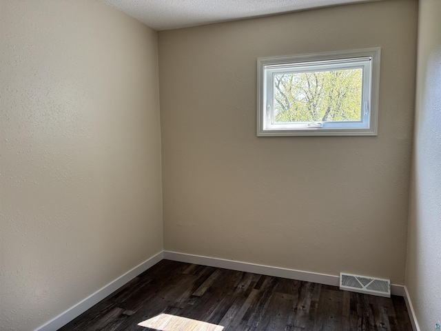 408 Midway Ave, Proctor, MN 55810 - spare room with dark wood finished floors and baseboards