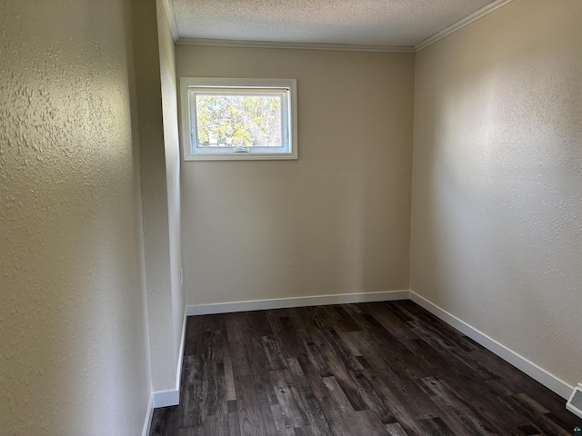 408 Midway Ave, Proctor, MN 55810 - unfurnished room with ornamental molding, dark wood-style flooring, a textured ceiling, baseboards, and a textured wall