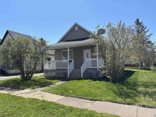 132 1st St, Proctor, MN 55801 - bungalow-style home featuring covered porch and a front lawn