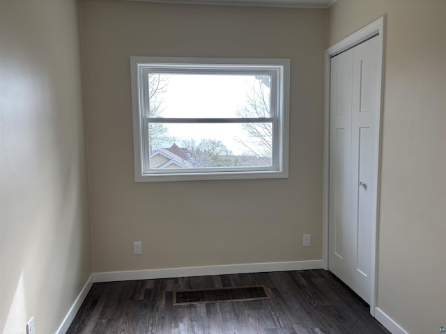 1417 N 7th Ave E, Duluth, MN 55805 - spare room featuring dark wood-style flooring and baseboards