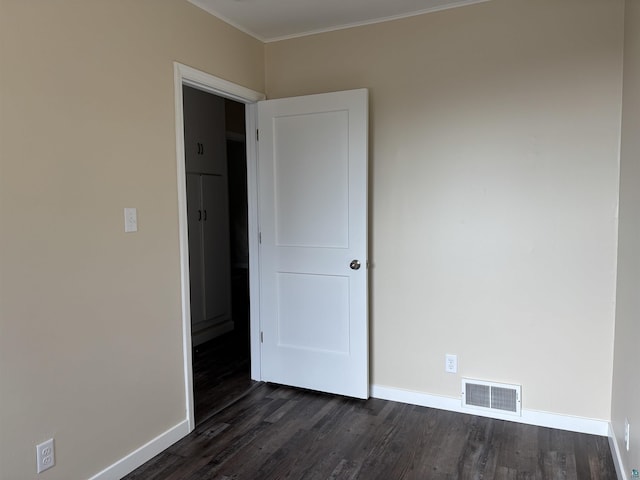 1417 N 7th Ave E, Duluth, MN 55805 - unfurnished room with dark wood finished floors, baseboards, and crown molding
