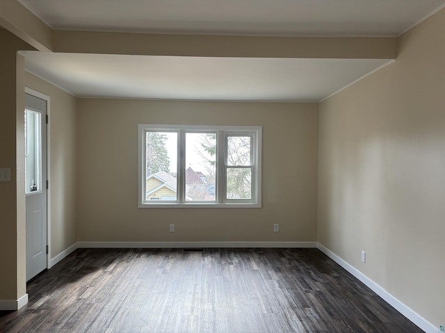 1417 N 7th Ave E, Duluth, MN 55805 - spare room with dark wood-type flooring, baseboards, and ornamental molding
