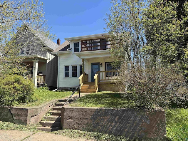 620 N 40th Ave W, Duluth, MN 55807 - view of front of house featuring a porch, a chimney, and a balcony