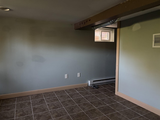 620 N 40th Ave W, Duluth, MN 55807 - below grade area with a baseboard heating unit, baseboards, and dark tile patterned flooring