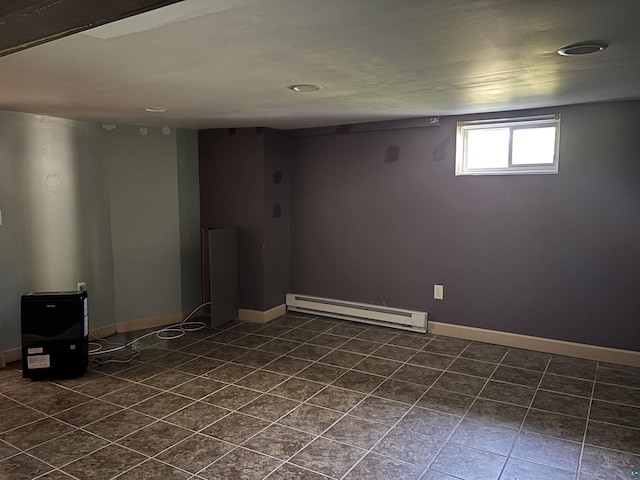 620 N 40th Ave W, Duluth, MN 55807 - below grade area featuring baseboard heating, dark tile patterned floors, and baseboards