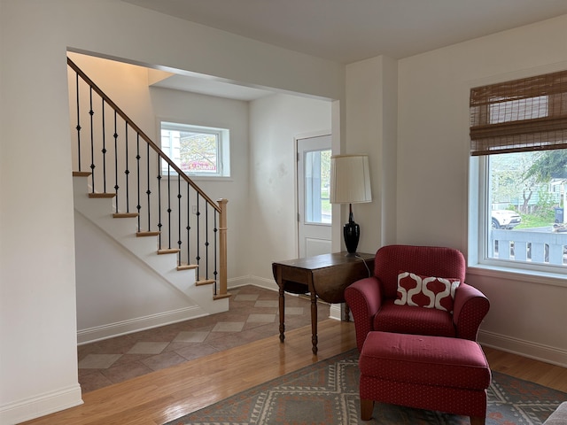 819 N 10th Ave E, Duluth, MN 55805 - sitting room with wood finished floors, stairway, and baseboards