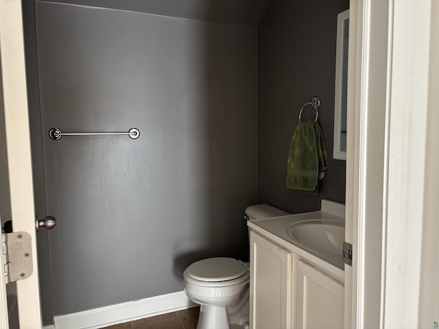 819 N 10th Ave E, Duluth, MN 55805 - half bath featuring vanity, toilet, tile patterned flooring, and baseboards