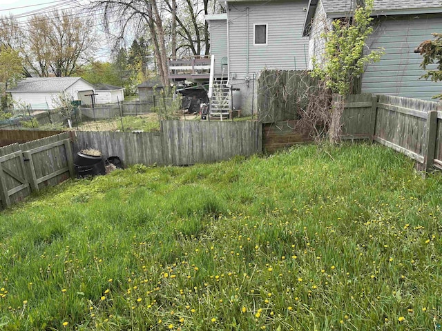819 N 10th Ave E, Duluth, MN 55805 - fenced backyard with a wooden deck and stairway