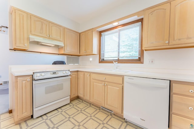 11 Ahola Rd, Ely, MN 55731 - kitchen featuring white appliances, light brown cabinetry, under cabinet range hood, a sink, and light countertops