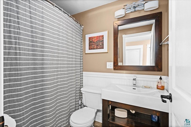 26 N 59th Ave W, Duluth, MN 55807 - full bath with toilet, a wainscoted wall, and vanity