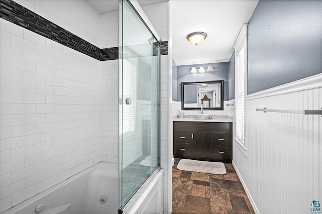 26 N 59th Ave W, Duluth, MN 55807 - full bathroom with stone finish flooring, vanity, a combined bath / shower with jetted tub, and a wainscoted wall