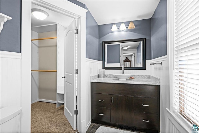 26 N 59th Ave W, Duluth, MN 55807 - bathroom with wainscoting, vanity, and a closet