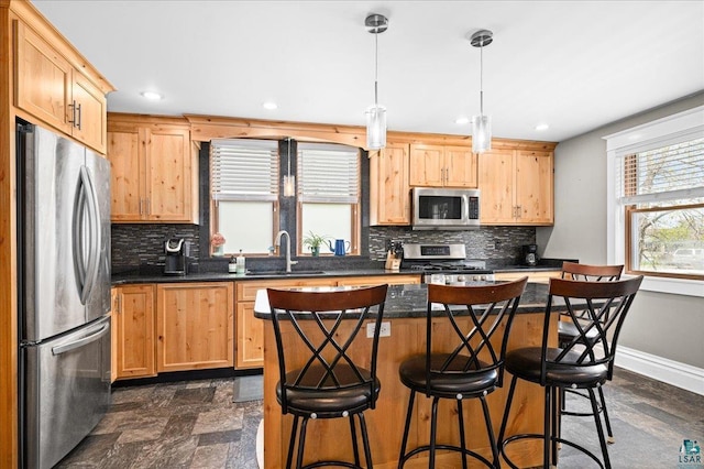 26 N 59th Ave W, Duluth, MN 55807 - kitchen with stainless steel appliances, a sink, dark countertops, decorative backsplash, and recessed lighting
