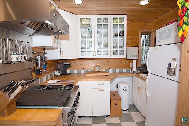 258 Soderberg Ln, Grand Marais, MN 55604 - kitchen with white appliances, ventilation hood, wooden counters, light floors, and recessed lighting