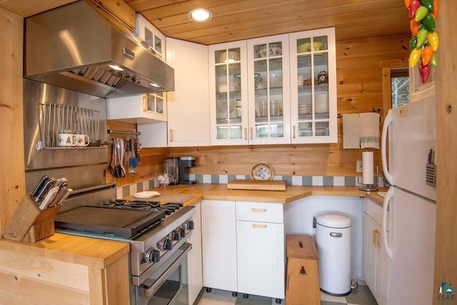 258 Soderberg Ln, Grand Marais, MN 55604 - kitchen featuring freestanding refrigerator, range hood, wooden counters, high end stove, and recessed lighting