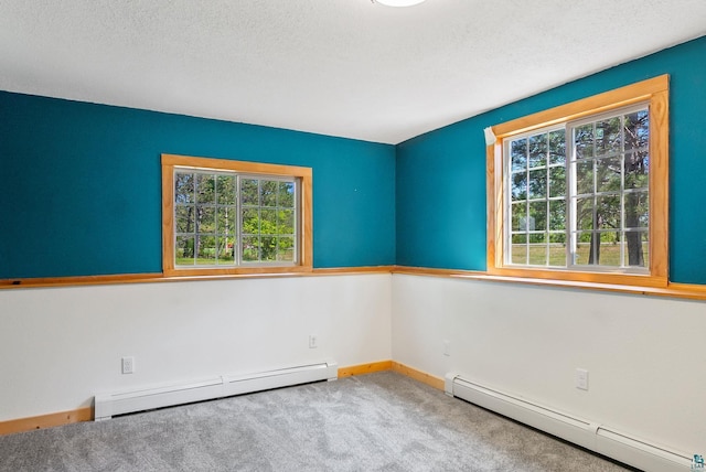 4527 Vermilion Trl, Gilbert, MN 55741 - carpeted empty room featuring a baseboard heating unit, baseboards, and a textured ceiling