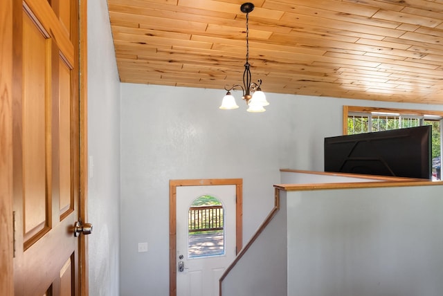 4527 Vermilion Trl, Gilbert, MN 55741 - foyer entrance featuring wood ceiling, a chandelier, plenty of natural light, and lofted ceiling