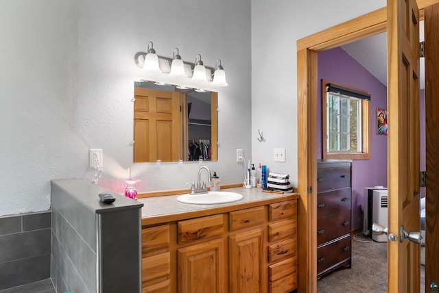 4527 Vermilion Trl, Gilbert, MN 55741 - bathroom featuring vanity and vaulted ceiling