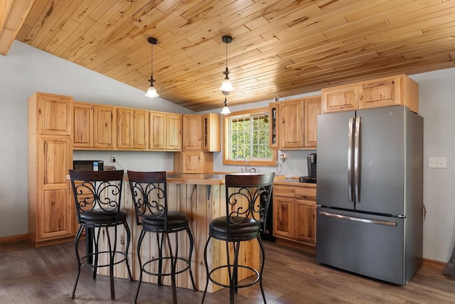 4527 Vermilion Trl, Gilbert, MN 55741 - kitchen with freestanding refrigerator, vaulted ceiling, a center island, dark wood-style flooring, and wooden ceiling