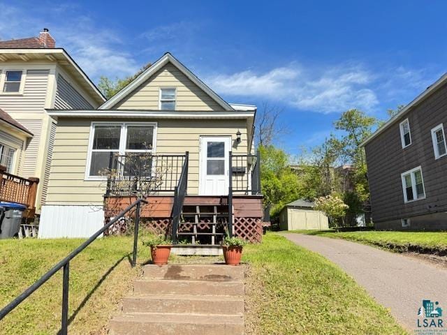 1917 Greysolon Rd, Duluth, MN 55812 - view of front facade featuring a wooden deck and a front yard