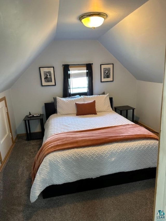 1917 Greysolon Rd, Duluth, MN 55812 - carpeted bedroom featuring vaulted ceiling and baseboards