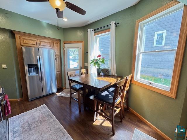 1917 Greysolon Rd, Duluth, MN 55812 - dining room with dark wood-type flooring, a ceiling fan, and baseboards