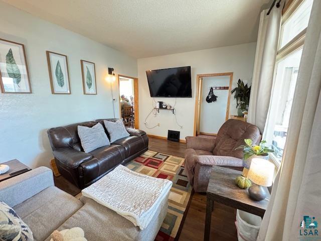 1917 Greysolon Rd, Duluth, MN 55812 - living area featuring healthy amount of natural light and wood finished floors