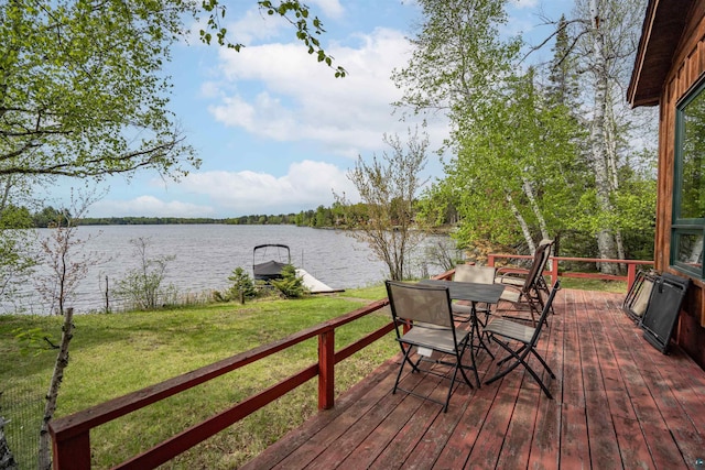 9320 W Branch Rd, Duluth, MN 55803 - wooden terrace featuring a water view, a yard, outdoor dining area, and a boat dock