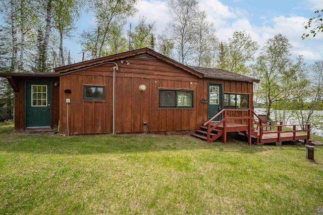 9320 W Branch Rd, Duluth, MN 55803 - back of house with a lawn, a deck, and board and batten siding