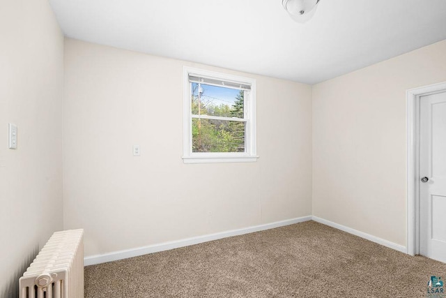619 W Skyline Pkwy, Duluth, MN 55806 - carpeted spare room featuring radiator and baseboards