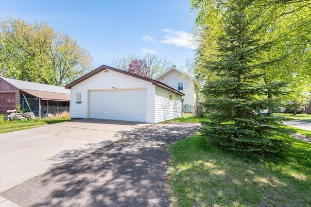 997 85th Ave W, Duluth, MN 55808 - view of front facade featuring an outbuilding and a detached garage