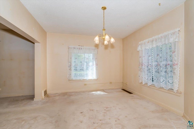 997 85th Ave W, Duluth, MN 55808 - unfurnished room with a chandelier, baseboards, and carpet floors