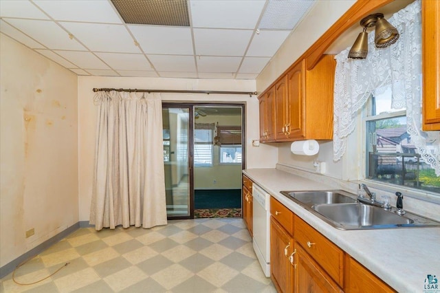 997 85th Ave W, Duluth, MN 55808 - kitchen with dishwasher, a sink, light flooring, light countertops, and a paneled ceiling