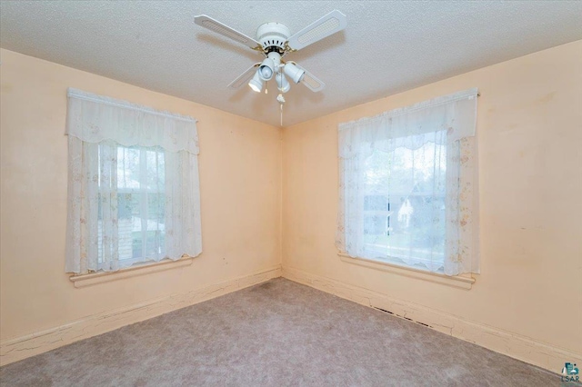 997 85th Ave W, Duluth, MN 55808 - carpeted spare room featuring a ceiling fan, a textured ceiling, and baseboards