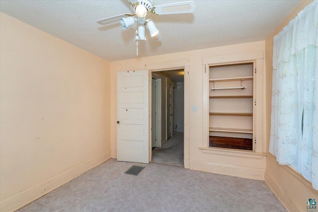 997 85th Ave W, Duluth, MN 55808 - unfurnished bedroom featuring carpet floors, a textured ceiling, and ceiling fan