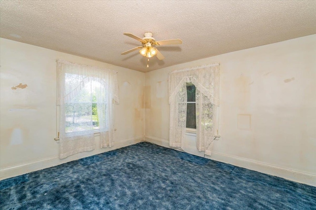 997 85th Ave W, Duluth, MN 55808 - empty room with ceiling fan, carpet, a textured ceiling, and baseboards