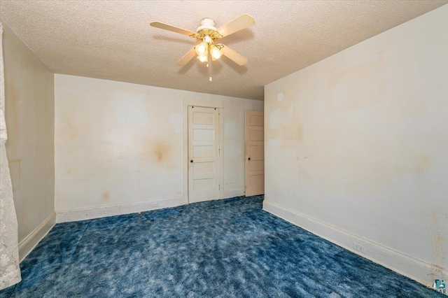 997 85th Ave W, Duluth, MN 55808 - carpeted spare room with a textured ceiling, ceiling fan, and baseboards