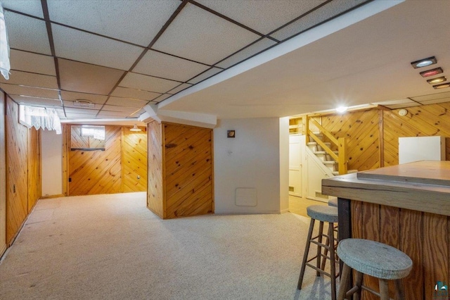 997 85th Ave W, Duluth, MN 55808 - finished basement with wooden walls, stairs, a dry bar, carpet, and a paneled ceiling