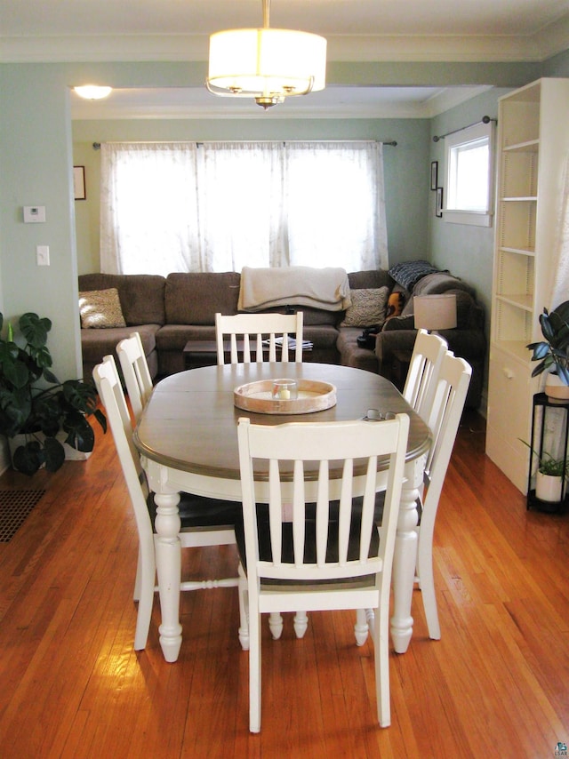 509 N 47th Ave W, Duluth, MN 55807 - dining room with ornamental molding and light wood-style floors