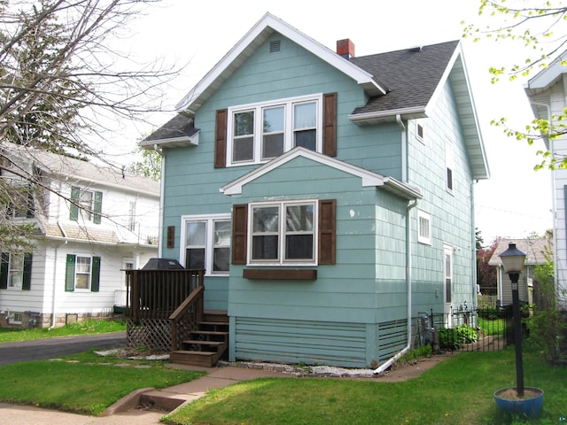 509 N 47th Ave W, Duluth, MN 55807 - traditional style home featuring roof with shingles, a chimney, and a deck