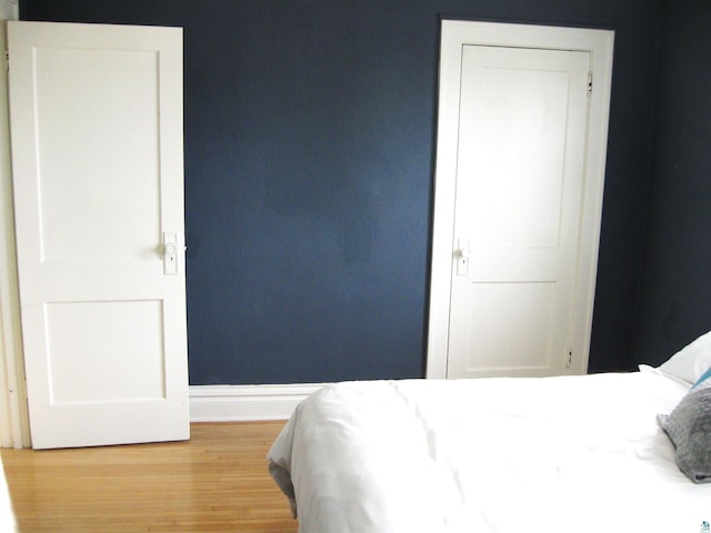 509 N 47th Ave W, Duluth, MN 55807 - bedroom with baseboards and wood finished floors